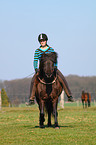 woman rides Icelandic horse