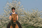 woman rides Icelandic horse