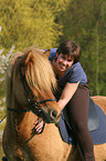 woman rides Icelandic horse
