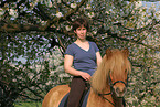 woman rides Icelandic horse