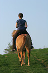 woman rides Icelandic horse