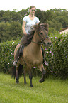 woman rides Icelandic horse