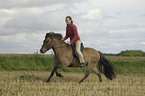 woman rides Icelandic horse