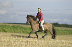 woman rides Icelandic horse