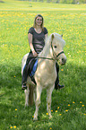 woman rides Icelandic horse