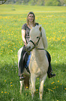 woman rides Icelandic horse