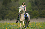 woman rides Icelandic horse