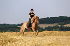 woman rides Icelandic horse