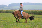 woman rides Icelandic horse