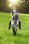 woman rides Icelandic horse