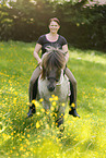 woman rides Icelandic horse