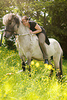 woman rides Icelandic horse