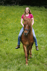 woman rides Icelandic horse
