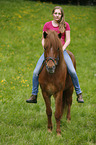 woman rides Icelandic horse