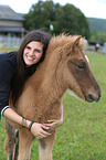 woman and Icelandic horse foal