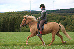 woman rides Icelandic horse