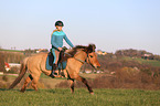 woman rides Icelandic horse