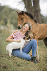 woman, dog and Icelandic horse foal
