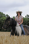 woman rides Irish Tinker