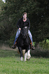 woman rides Irish Tinker