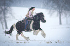 woman rides Irish Tinker