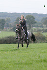 woman rides Konik