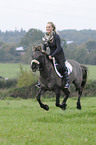 woman rides Konik