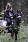 woman rides Konik