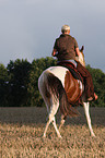 woman rides pony