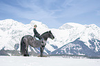 woman rides Noriker Horse