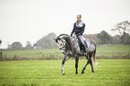 woman rides Oldenburg Horse