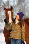 woman with Paint Horse in snow
