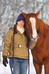 woman with Paint Horse in snow