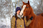 woman with Paint Horse in snow