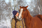 woman with Paint Horse in snow