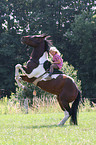 girl rides Paint Horse