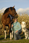 woman with polish warmblood and border collie