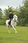 girl rides pony