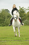girl rides pony
