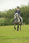 girl rides pony