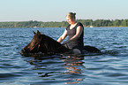 woman rides pony