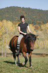 woman rides crossbreed