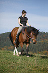 woman rides crossbreed
