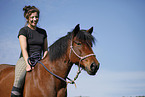 woman rides crossbreed