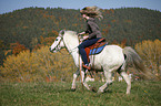 woman rides pony