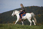 woman rides pony