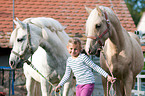 girl and ponies