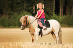 girl rides pony