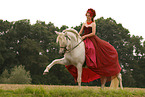 woman is riding a Pura Raza Espanola