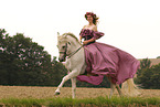 woman is riding a Pura Raza Espanola